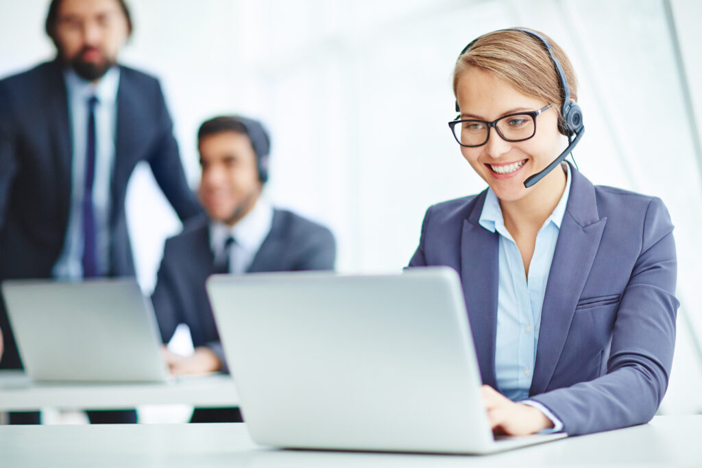 Operator consulting with clients online with a headset.