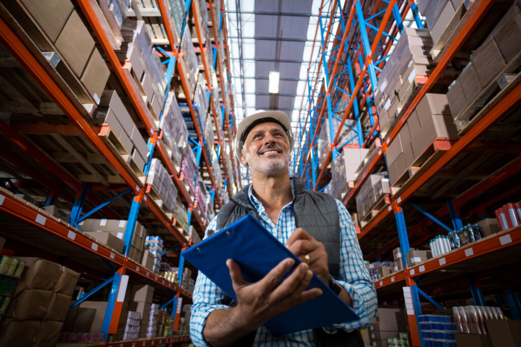 Manager reviewing warehouse inventory