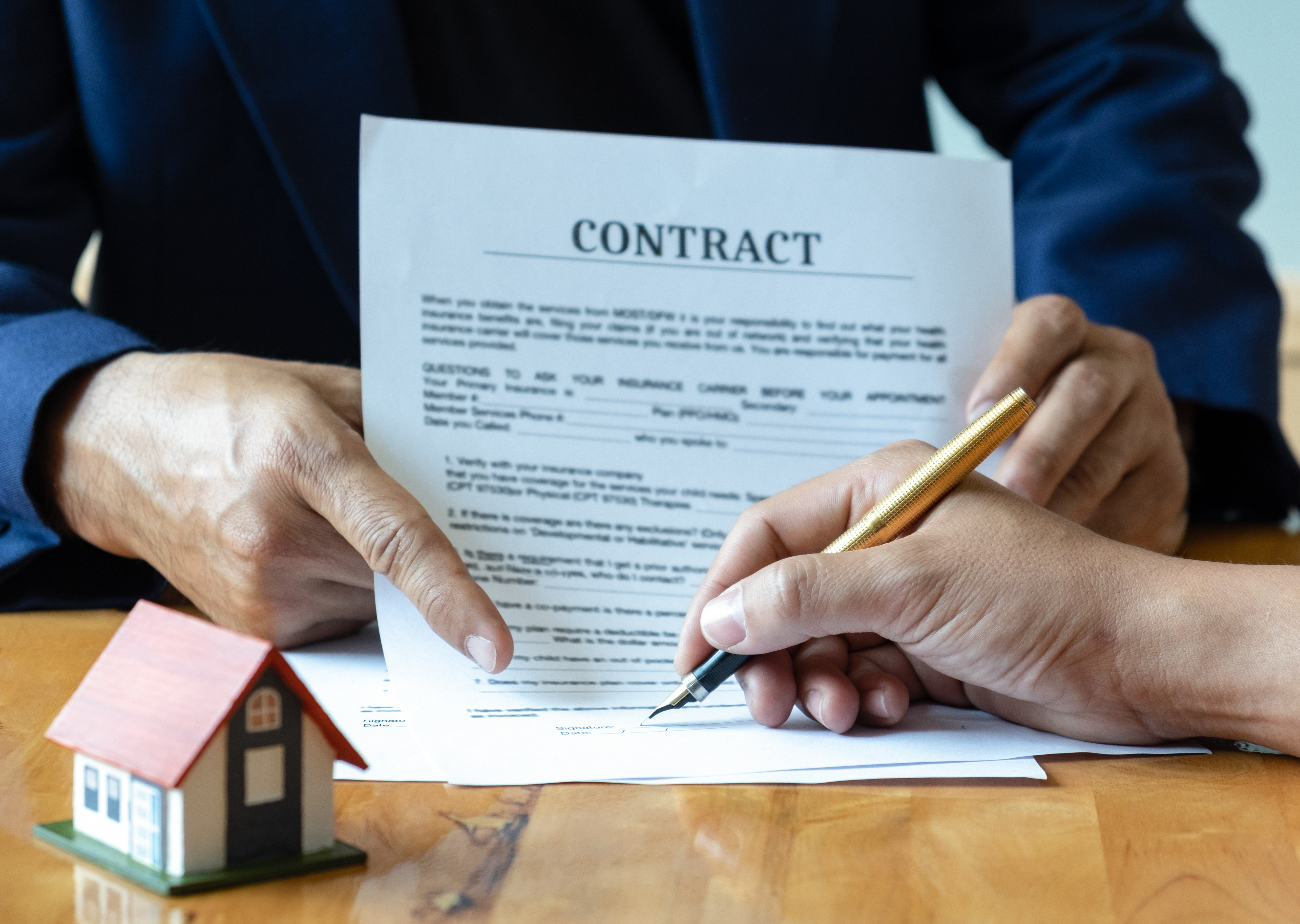 Signing a contract for a home.
